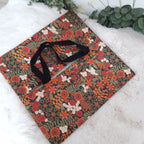 Sac à tarte en tissu enduit - Fleurs orange et noire